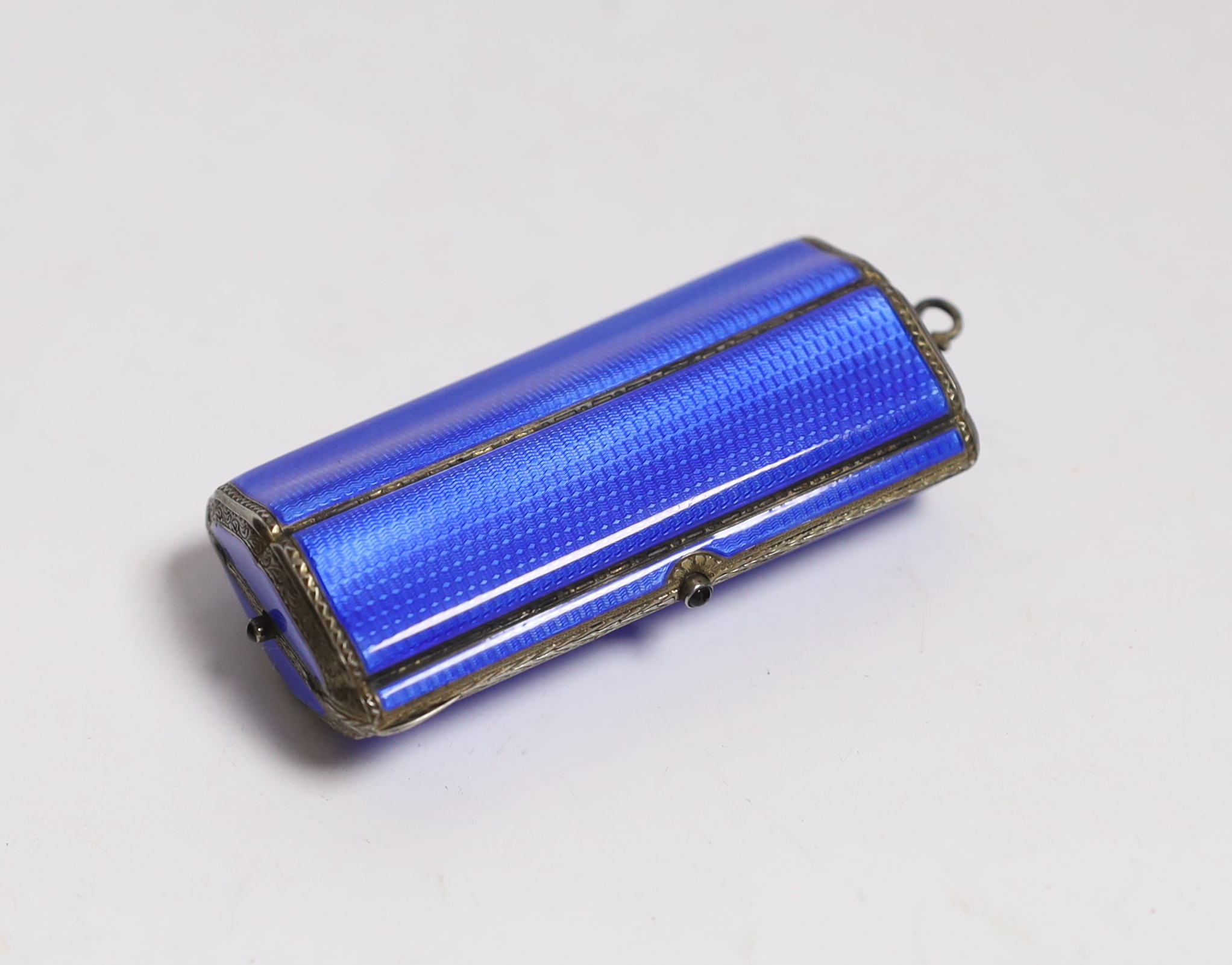 A lady's George V silver gilt and guilloche enamel minaudiere, of shaped oval form with compartmental interior, import marks for P.H. Vogel & Sons, London, 1923, 81mm.
